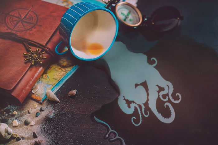 a creative still life featuring a cool reflection in a coffee cup