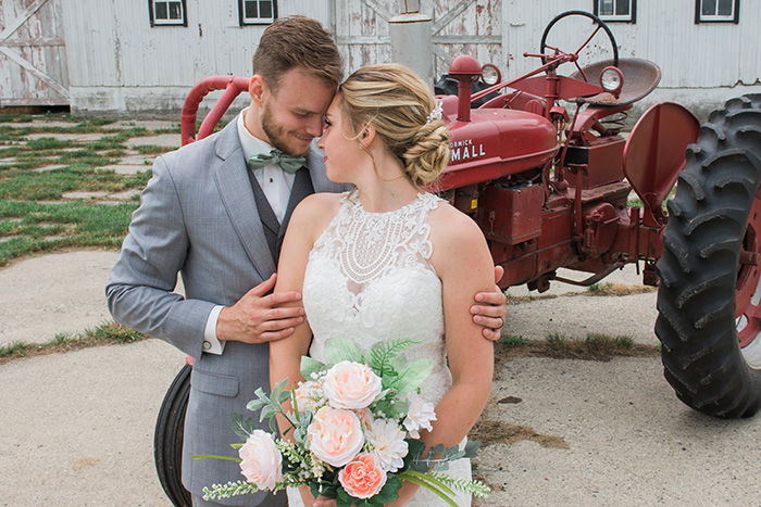 portrait of the newlywed couple embracing at an outdoor wedding photography shoot