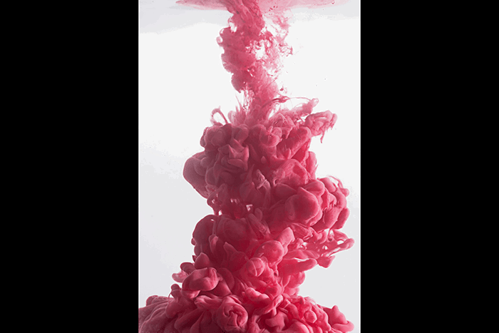 An abstract pink cloud using colorful paint in water photography technique