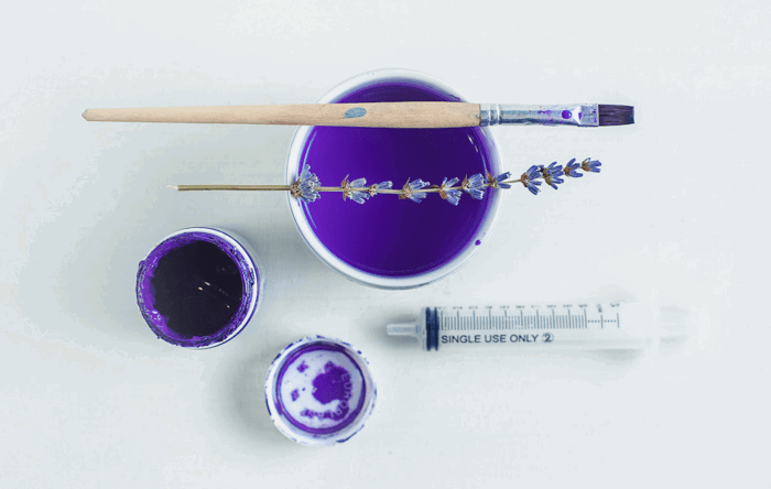 Overhead shot of mixing paint to shoot colorful paint in water photography