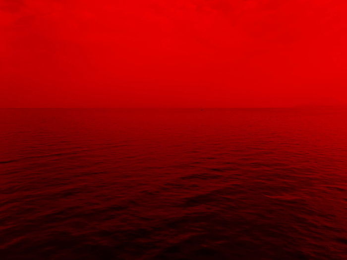 a red toned seascape - symbolism in photography