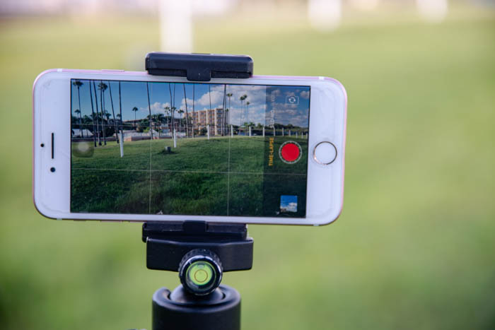 a phone on a tripod outdoors to shoot iphone time lapse photography