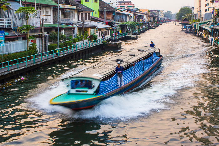 A freeze motion photography shot of a barge on a river