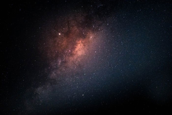 Nebula and starts glowing in a night sky with stars as an example of astrophotography