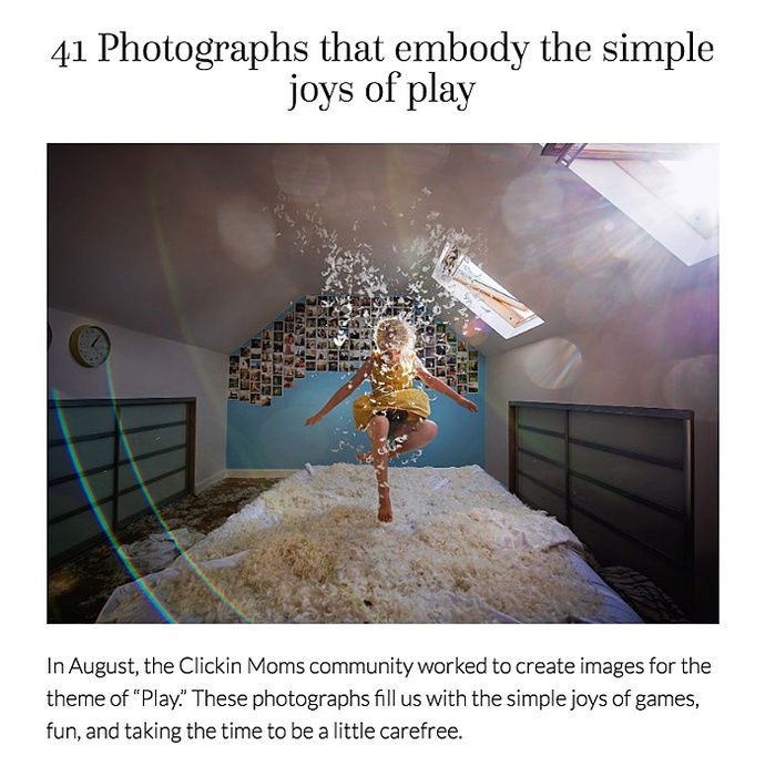 Photo of a girl jumping on a bed with feathers in the air