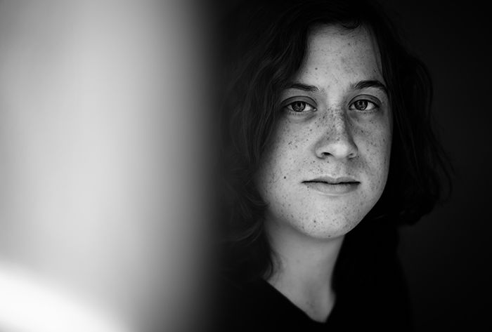 close-up portrait photography of a woman with blurry foreground