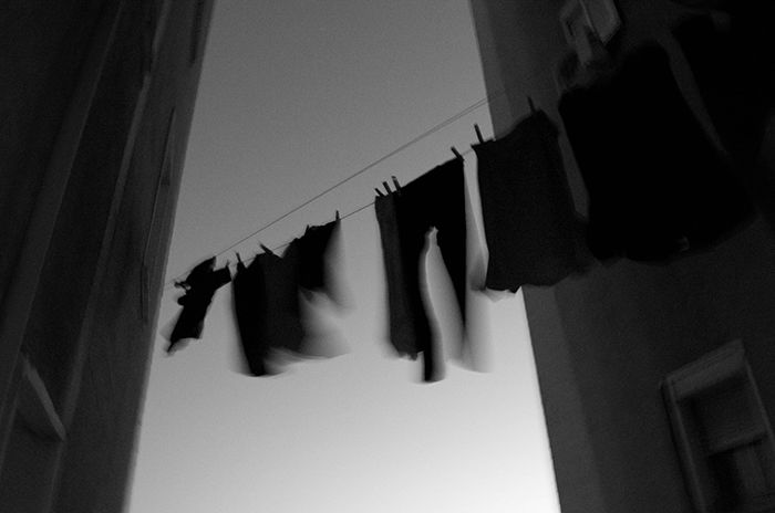 Motion blur photo of hanging clothes moved by the wind