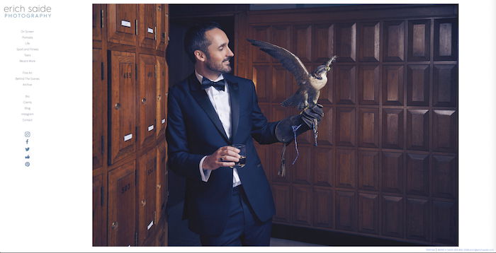 Photo of an elegantly dressed male model with a falcon in his hand by Erich Saide