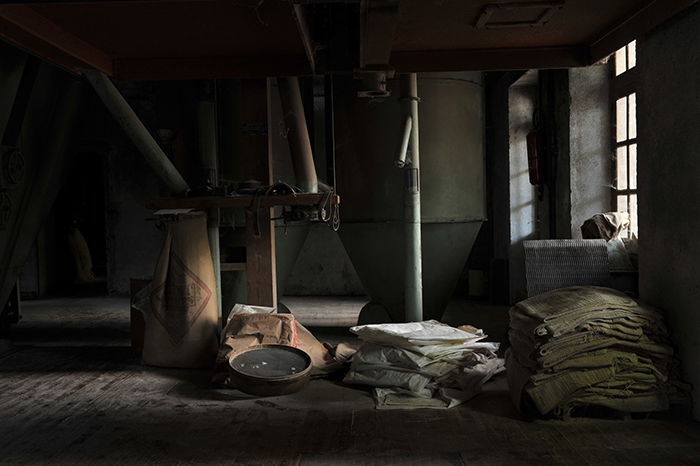 A photo of a dark room with side light coming through the window