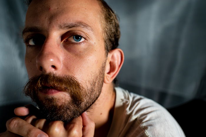 close up portrait of a man with bright blue eyes