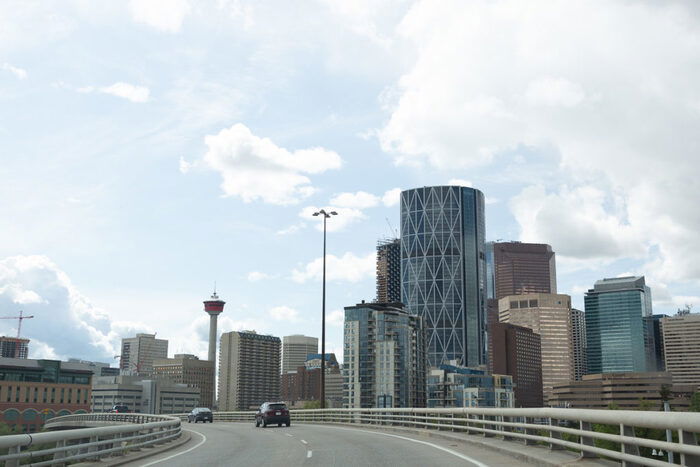 Photo of skyscrapers shot from a car on the driveway