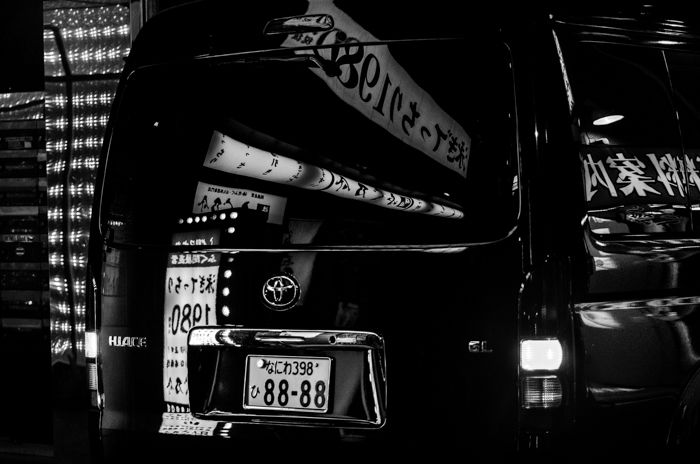 Black and white png file of a black van with building reflections