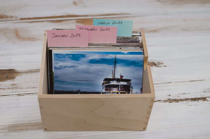 a nbox of printed photo for use in scrapbooking creations