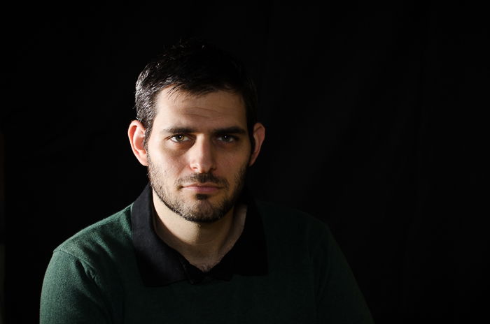 Portrait photo of a man in split lighting