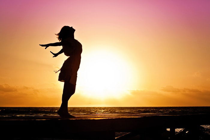 A person silhouetted against a sunset for a cool photography effect