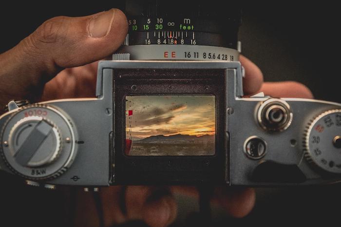 Top view of Kodak camera LCD viewfinder showing a sunset landscape