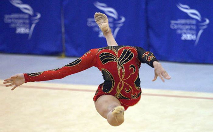 Photo of a gymnast jumping in the air