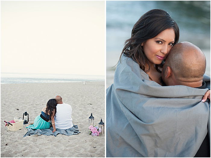 A couple cuddling on the beach 