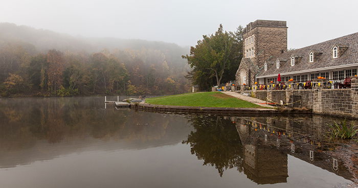 Photo of a building on the side of a lake