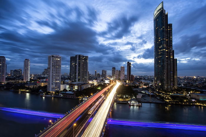 Photo of a cityscape with a light trail