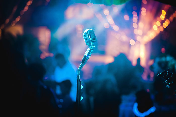 a microphone stand at a nighttime event 