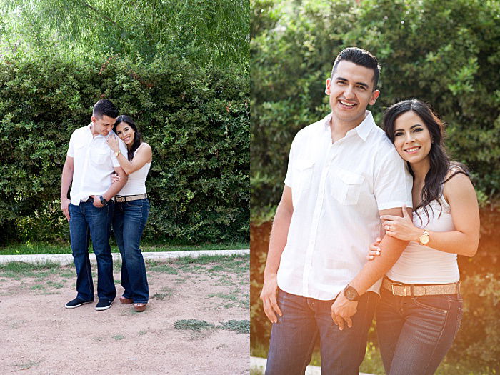 A couple standing in a garden shot with the arm hold pose 