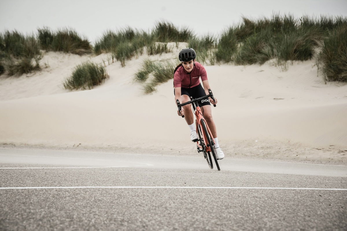 A bike rider turning a corner on an outside track as an example of cyclist photography