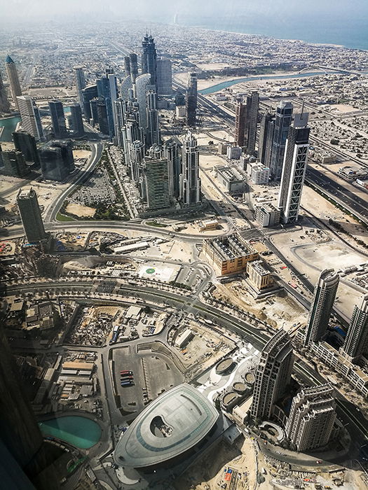 A drone photo of a huge city with skyscrapers