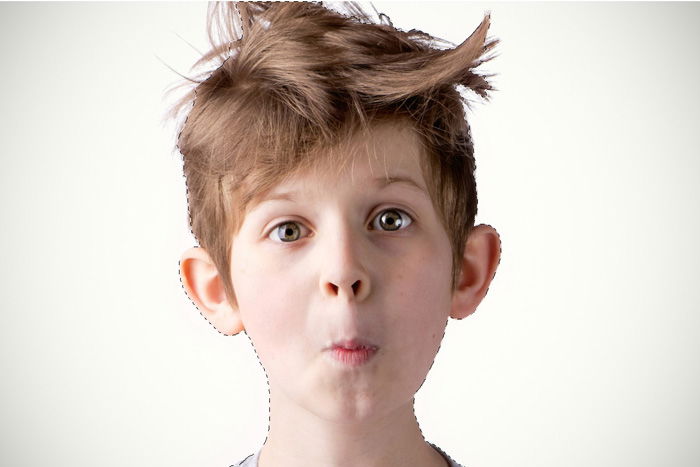 Using Photoshop to make a selection of a portrait of a little boy with messy hair