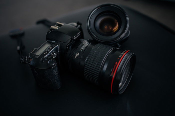 Photo of a camera and a lens