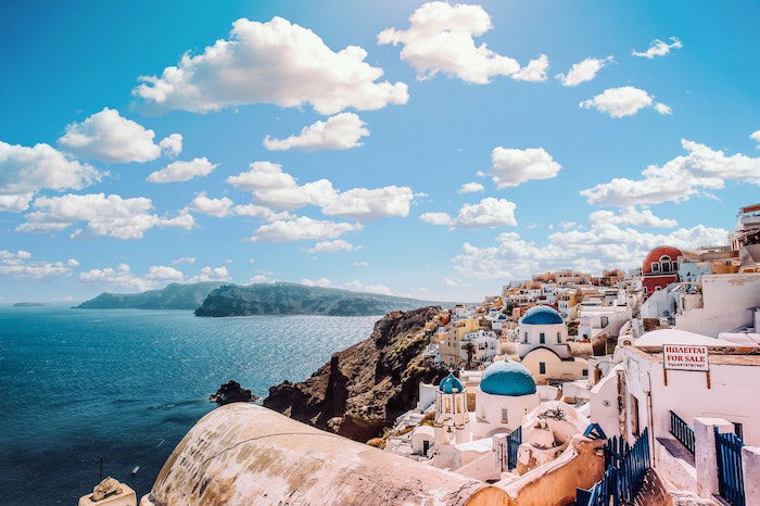 An edited image of a Greek seaside town 