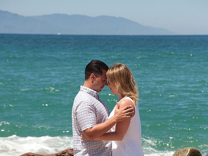 a portrait of a couple trying the classic forehead to forehead engagement photo poses outdoors