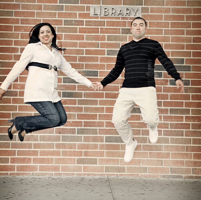 Fun engagement portrait of a couple jumping