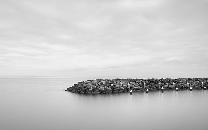 High key image of a pier.