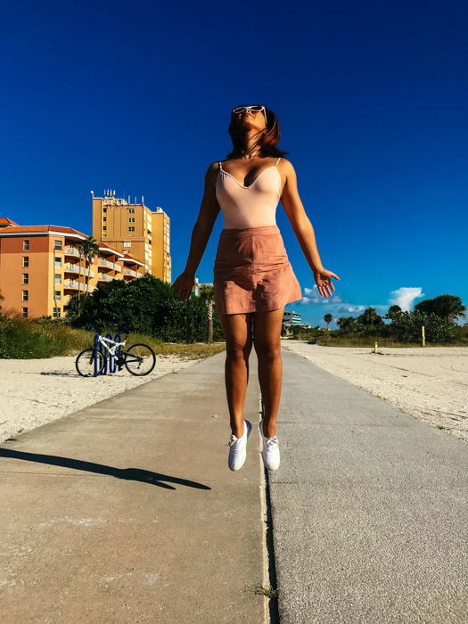 A girl captured whilst jumping in the air 