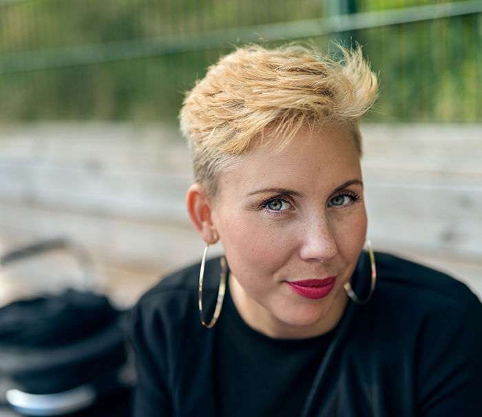 a professional headshot photo of a stylish young woman