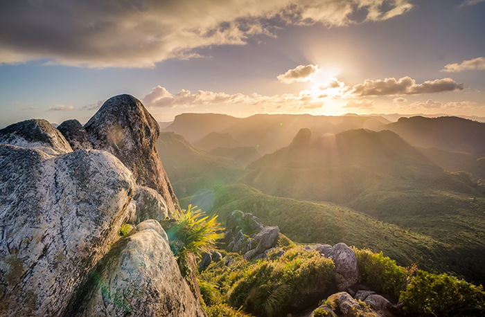 The sun setting over mountains 