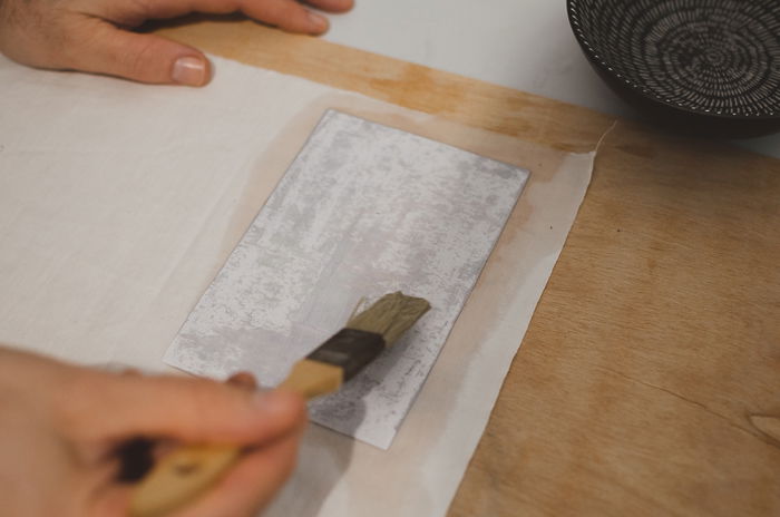 Applying water on paper with a brsuh