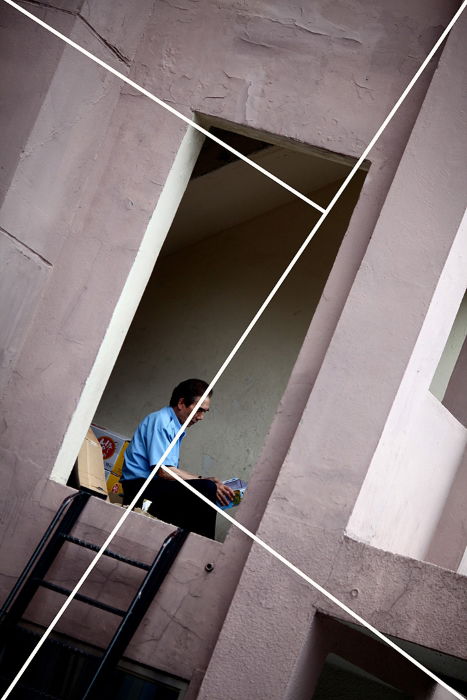 Image of a man through a door way with a composition overlay 