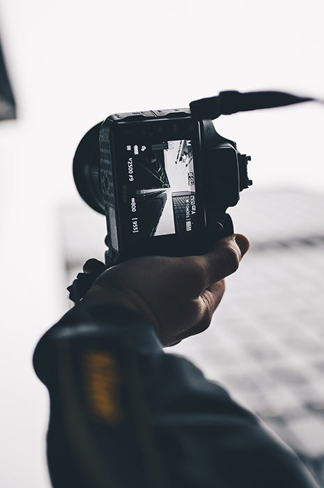 Photo of hands holding a camera