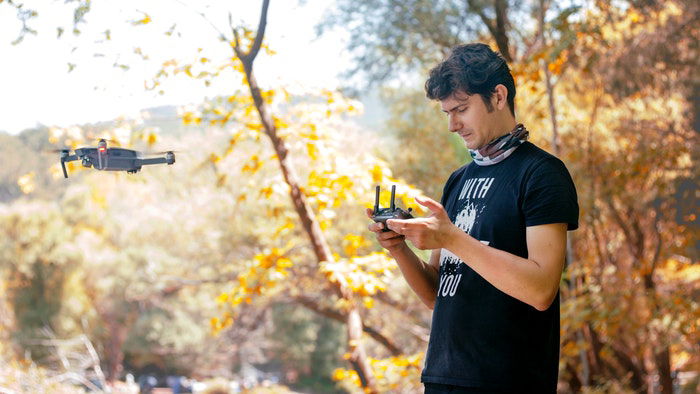 A man flying a drone