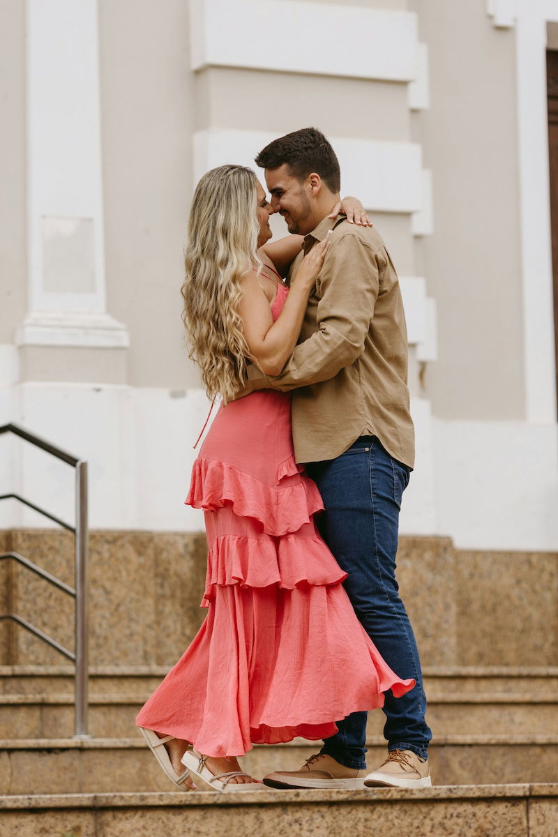 Two people dancing on steps outside for couple poses