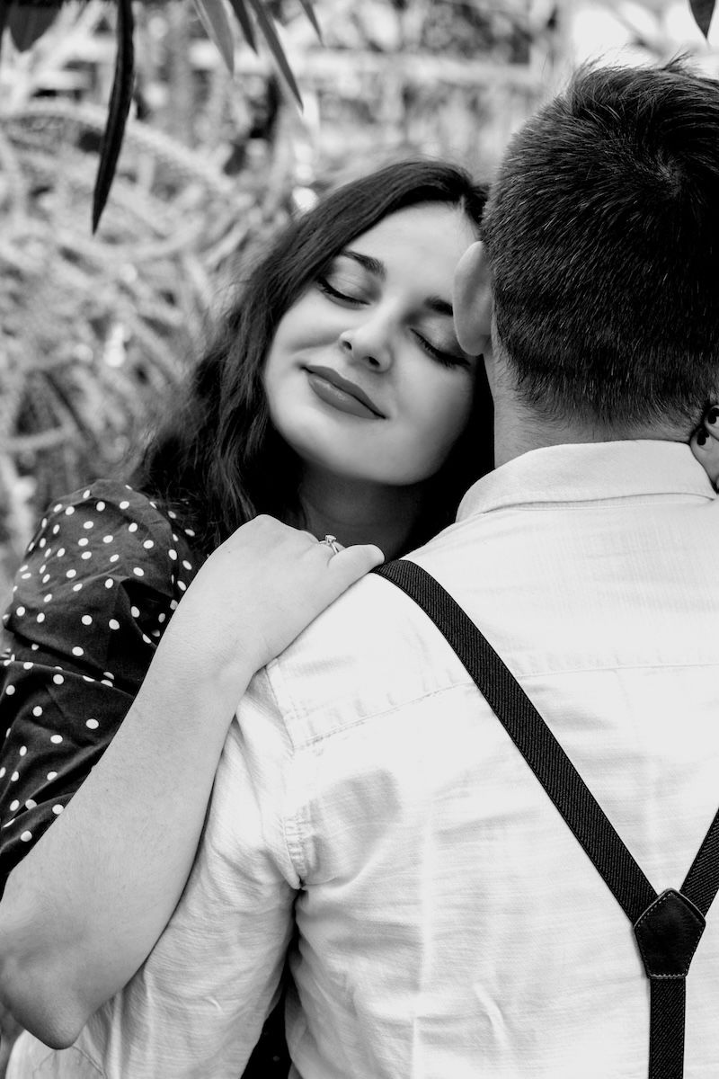 A woman leaning on her partner for couple poses