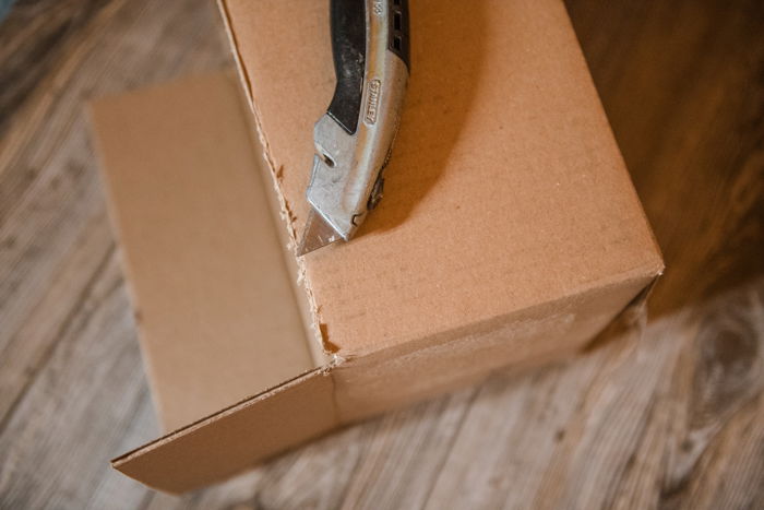 Removing the top of a cardboard boxes to make a softbox