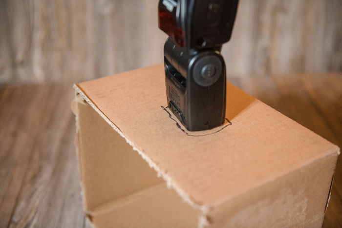 Cutting a cardboard box to make a DIY softbox