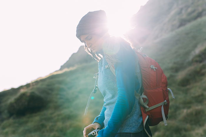 Outdoor portrait of a women with lens flare.