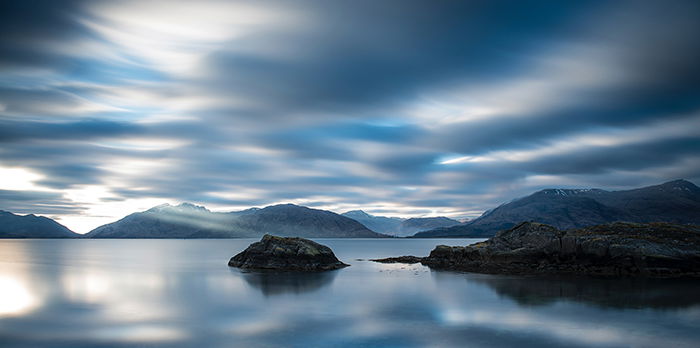 long-exposure image of a lake at evening time