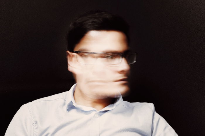 Long exposure portrait of a man with glasses 