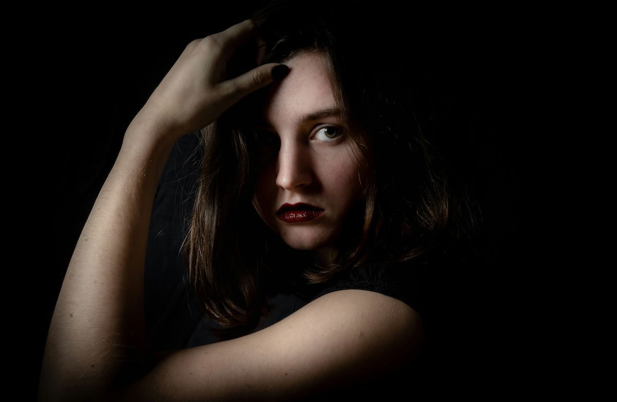 A sharp closeup studio portrait taken with a camera flash