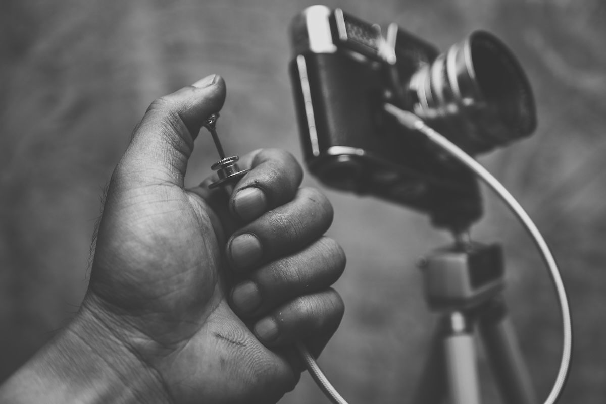 An old mechanical cable release and camera